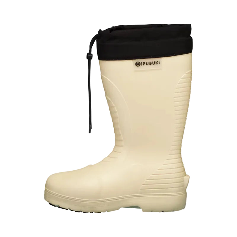 Cream winter boot with black cuff, rugged sole, and cozy mountain vibe for outdoor adventures