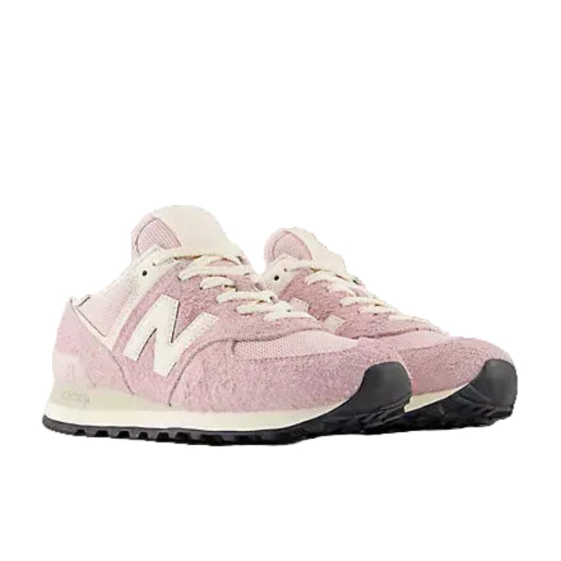 Cozy light pink sneakers with textured suede, perfect for mountain town adventures