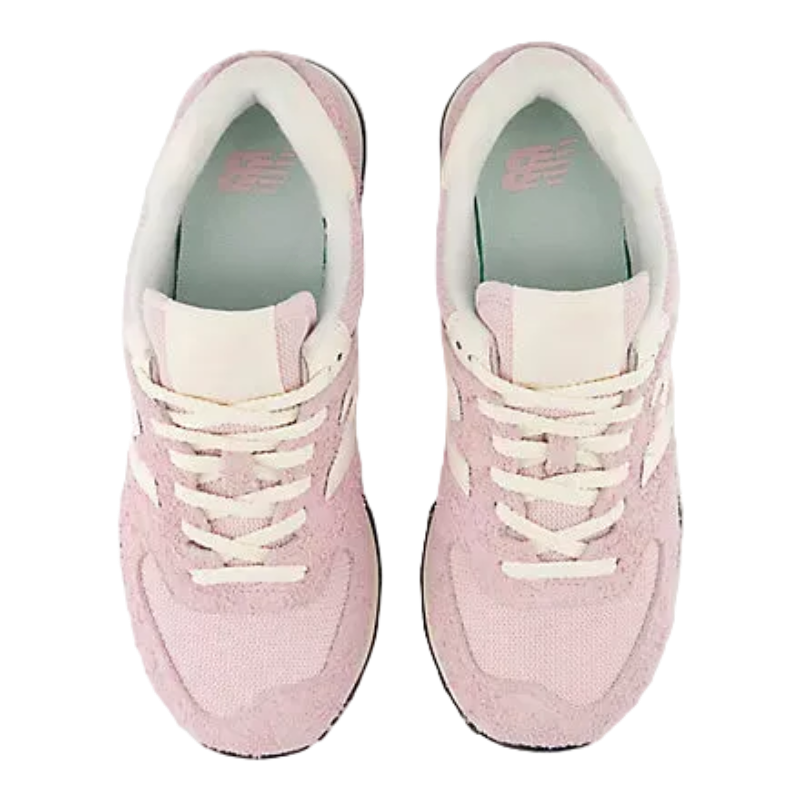 Pair of pink athletic sneakers with white laces, perfect for mountain town adventures
