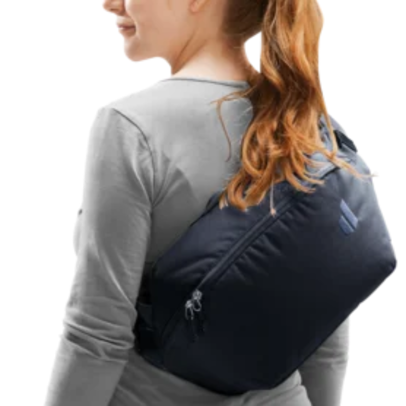 Woman wearing a crossbody bag on a white background